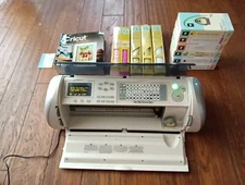Cricut CRV001 Personal  Cutter Machine  6 Cartridges, Vinyl Paper & Magazines
