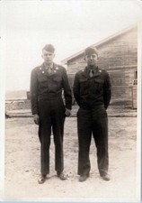 WW2 Photo of Two Soldiers Standing Outside Wooden Building
