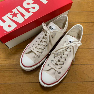 white converse with red line