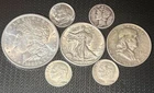 Lot of 7 - US 90% Silver Coins (Walking Liberty Half Dollar, Morgan silver,....)