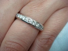 PLATINUM 1 CARAT T.W. CHANNEL SET ETERNITY BAND COMFORT FIT 4.9 GR, SIZE 5.75.