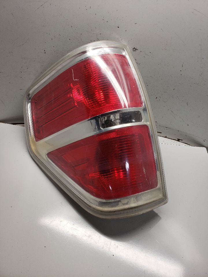 09-14 Ford F150 Pickup Driver Tail Light Styleside with Bright Border 1333491