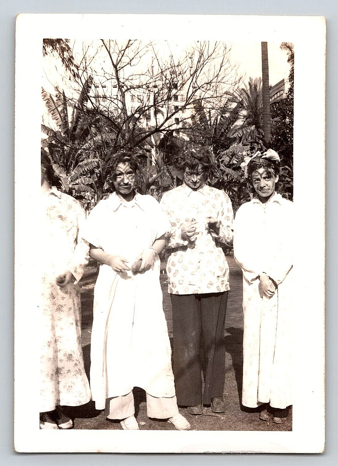 Vintage Outdoor Photo of Women and Girls in Dresses with Painted Faces