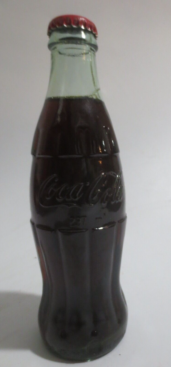 Coca-Cola Embossed Bottle 8 oz 237ml No refill Please recycle on