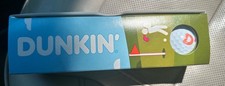 Pelota de golf Dunkin Donuts 2026 (una) y caja Munchkins