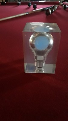 Pierre Giraudon glowing blue lightbulb in lucite. 