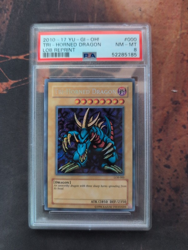 Tri-Horned Dragon - PSA 8 - LOB-000 - LOB REPRINT - Secret Rare
