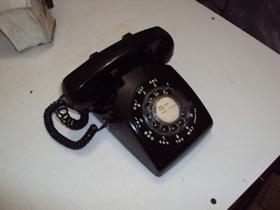 Vintage USED ITT rotary phone, Black in color, Untested, Very nice condition.