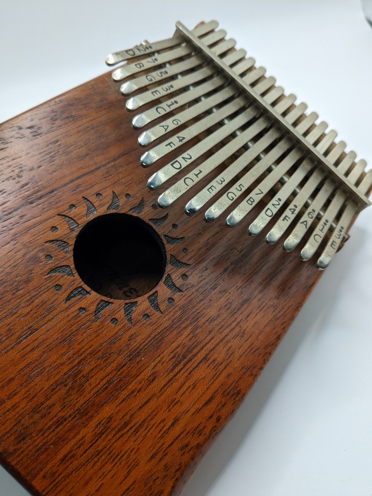  17 Key Kalimba w, Tuning Hammer Sun Pattern Around Middle 