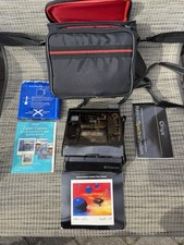 Vintage Polaroid Spectra System Camera with Film, Case, Bag, Strap, and Manual