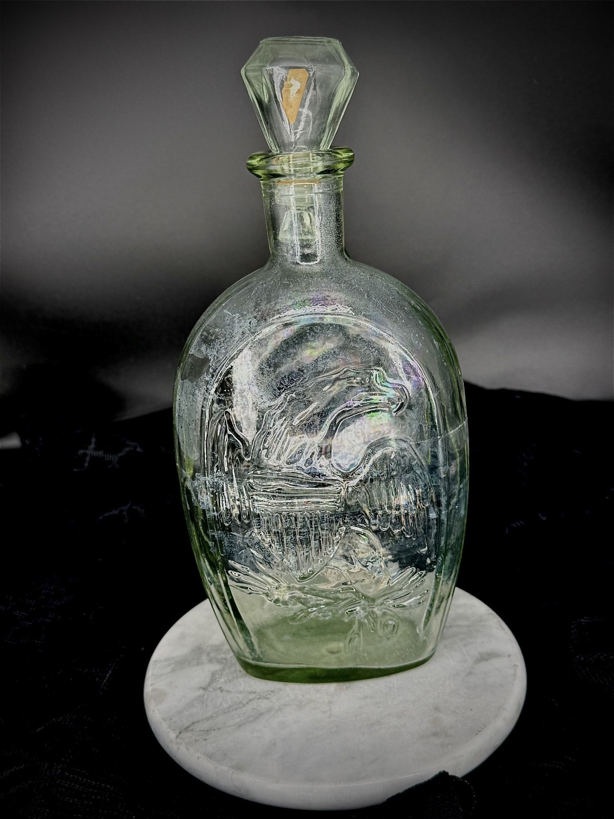 vintage glass bottle "historical flask" features an embossed profile of Lady Lib