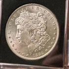 1884-O Morgan Silver Dollar. Brilliant AU Quality!