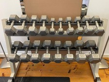 Dumbell rack, Grey steel Hex Type weights 10bls to 50 lbs in 5 lb increments.