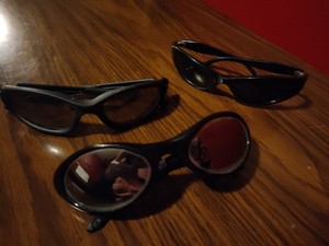 3 Black Sun Glasses, 2 Are Reflective.