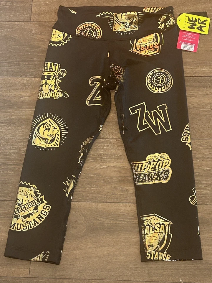 Leggings Zumba All Stars Capri Adulto Extra Pequena Dourada~Preta Feminina - Imagem 2 de 4