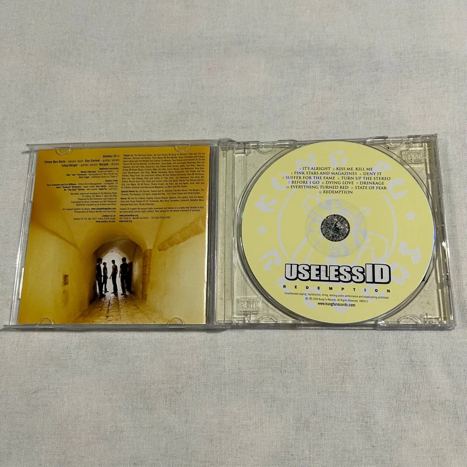 CD de canje de identificación inútil 2004 Foto 4 de 4