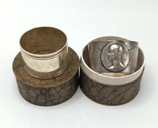 OUR LADY OF LOURDES & OTHER PLAIN NAPKIN RINGS. UNSIGNED IN AN OLD JEWELLERY BOX