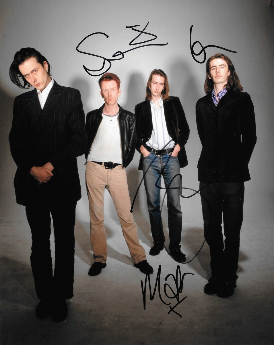 suede rock band full body portrait music group from the 1990's