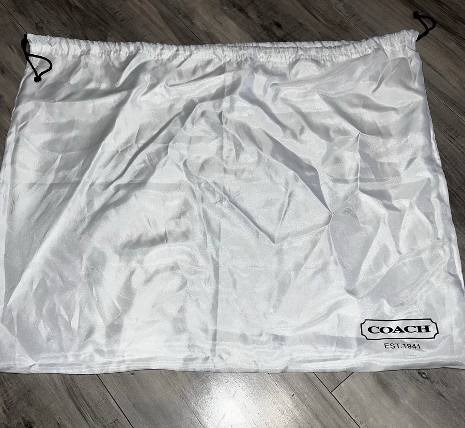 Cubierta para bolsa antipolvo Coach Foto 3 de 4