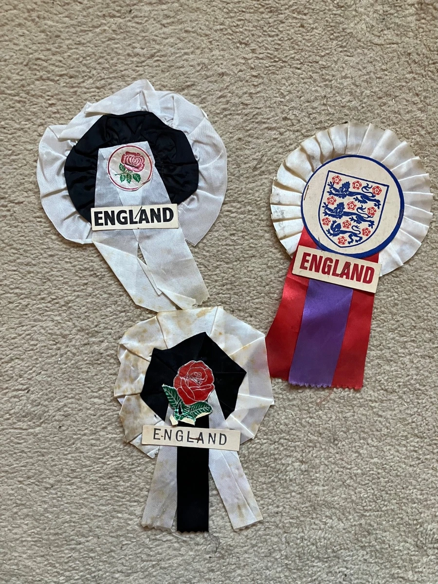 A quantity of England football rosettes; together with various England