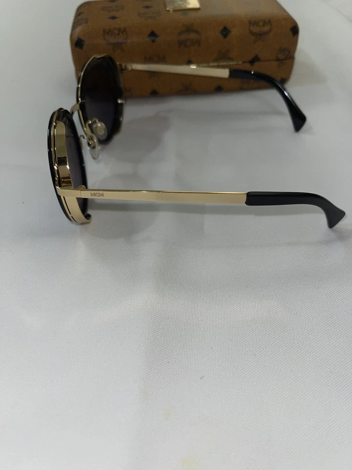 Gafas de sol MCM para hombre con lente dorada negra edición limitada 🔥 Foto 4 de 4