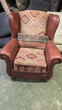 Tetrad leather and fabric wingback armchair