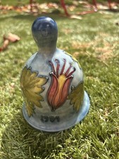 Moorcroft pottery Annual Bell for 1984 in the Columbine pattern