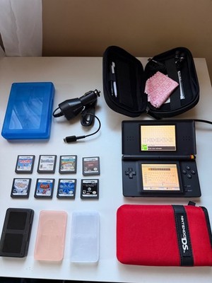 Nintendo DS lite console with 9 games, charger, cases