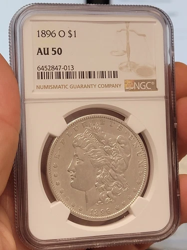 1896-O MORGAN SILVER DOLLAR. NGC GRADED AS AU-50