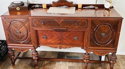 vintage Jacobean-style sideboard buffet, commonly produced in the early 20th cen