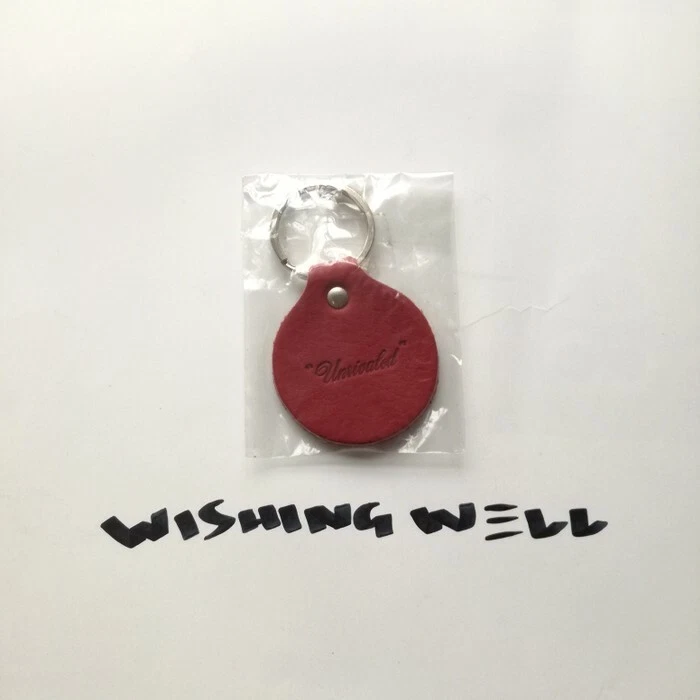 UNRIVALED LEATHER KEYCHAIN RARE SUPREME KAWS