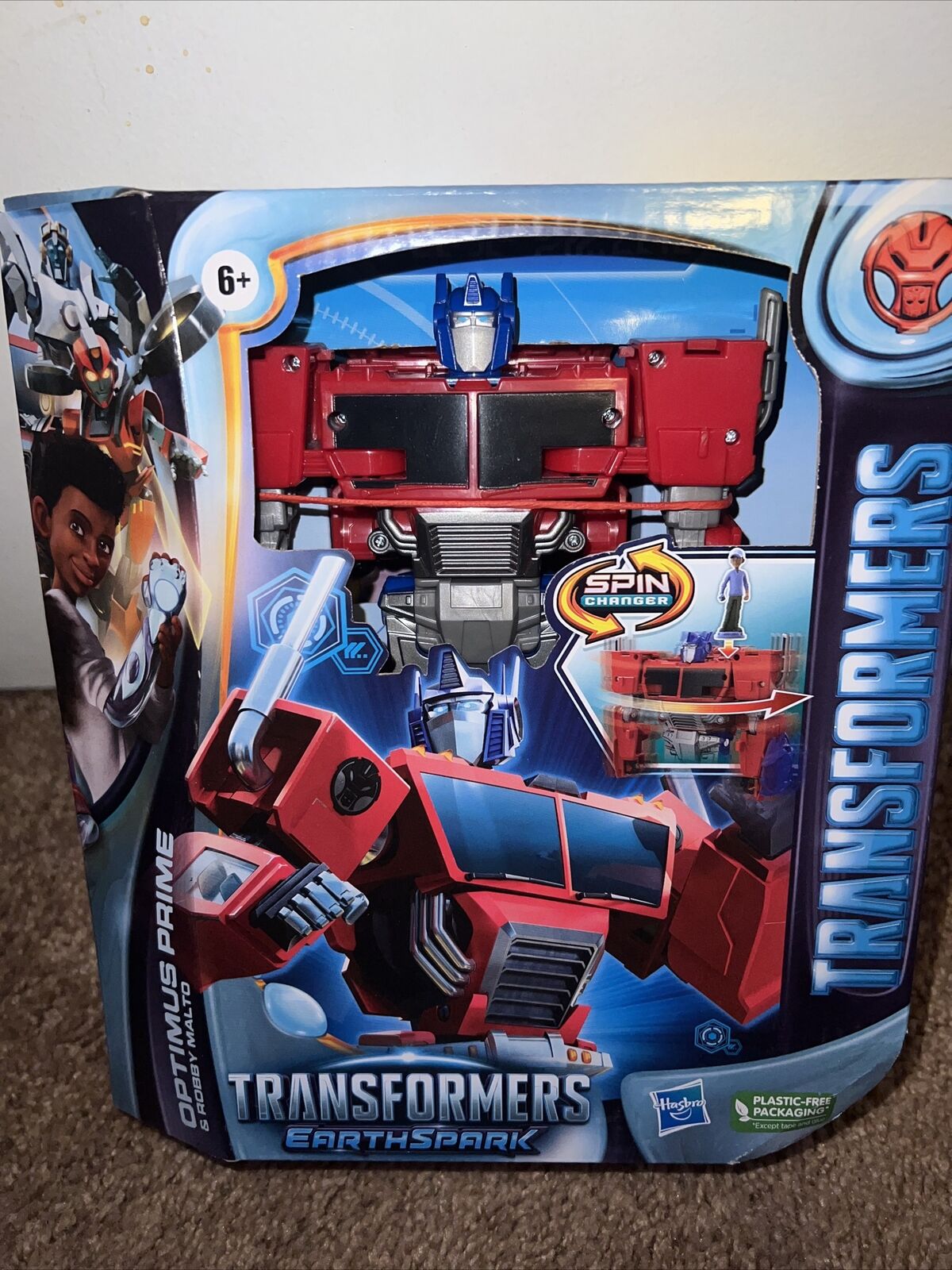 Transformers Earthspark Deluxe Optimus Prime e Robby Malto