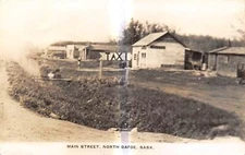 NORTH DAFOE Saskatchewan Canada RPPC postcard Main Street view house taxi stand