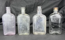 4 Antique WARRANTED REGISTERED HALF PINT FLASK Pink Clear Whiskey Bottles 6.75"