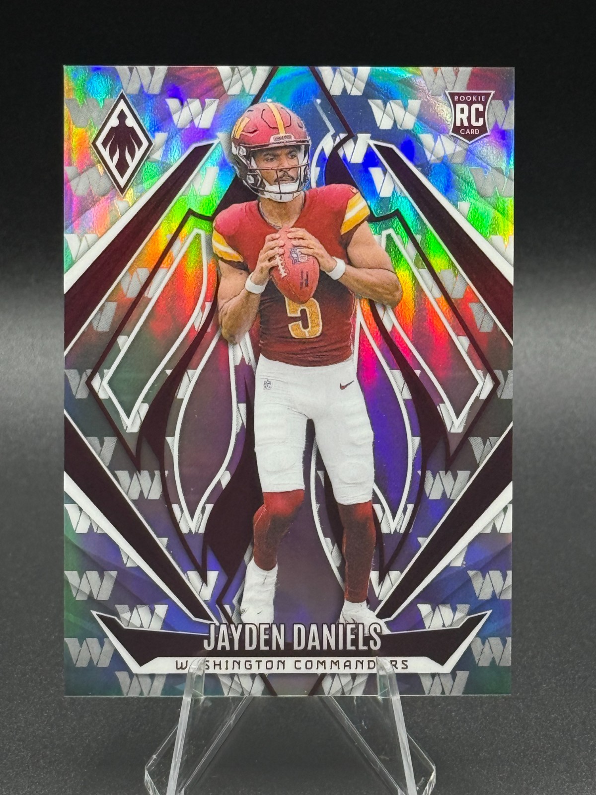 2024 Panini Phoenix - Rookies Jayden Daniels #198 Team Logos /299 (RC)