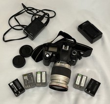 Nikon D70 camera with Promaster 28-210mm Lens, 5 Batteries, and Two Chargers.