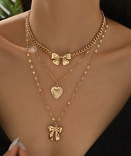 Gold Tone Jewelry Set with Necklace, Bow  Heart Pendants, Layered Design