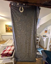 A pair of grey curtains with a metallic fleck. each panel is 226cm wide X 228 cm
