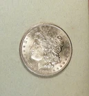1883-CC Morgan Dollar, grades BU+/CH BU, Slight Damage Right of Liberty's Head.