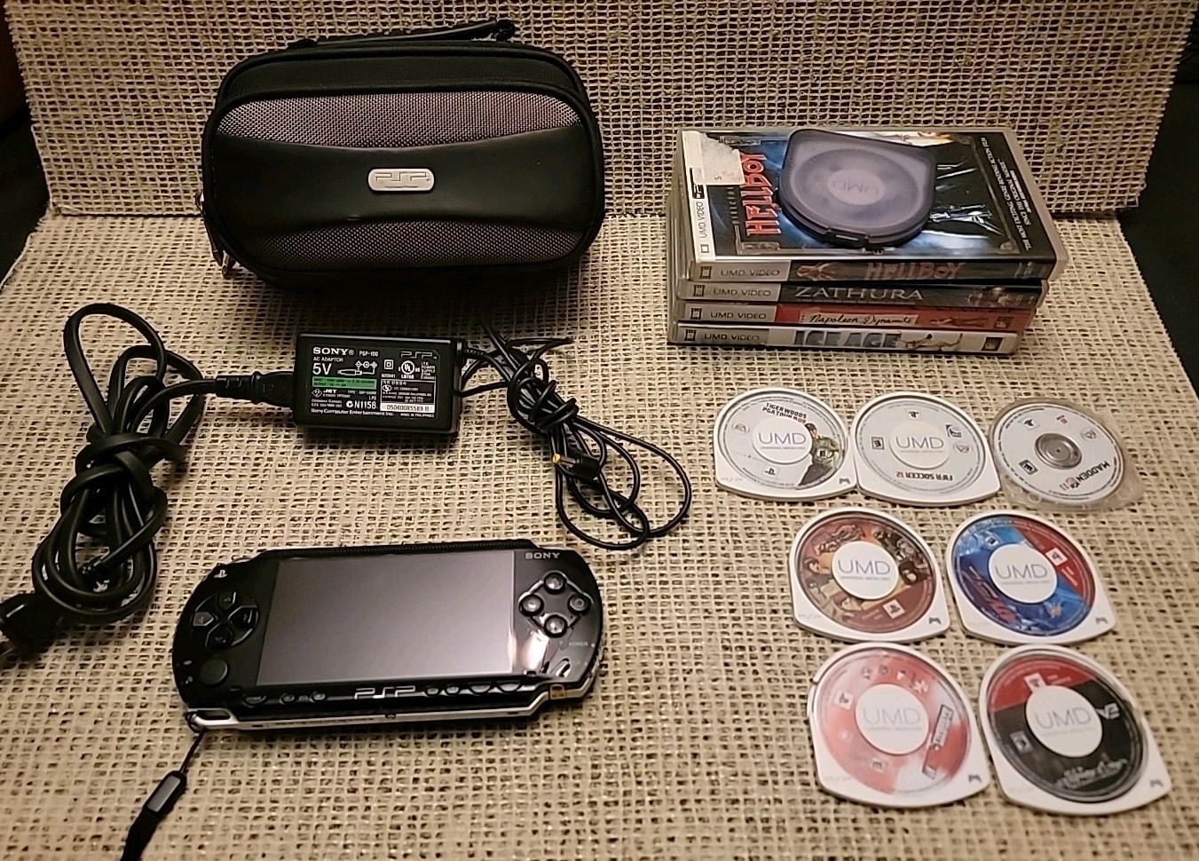 Sony PSP-1001 Black Handheld With 7 Games / 5 movies / Charger & Case