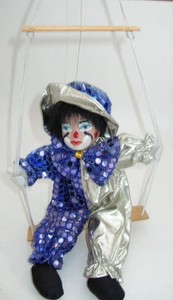 porcelain clown on swing