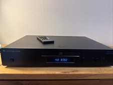 This is a Cambridge Audio Topaz CD10 CD Player with remote control.