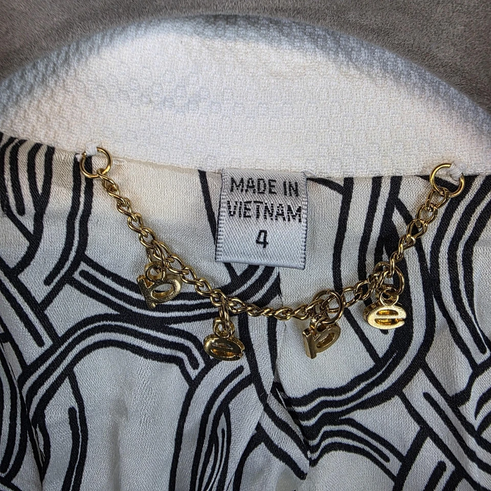 Chaqueta Blazer Bebe Mujer 4 Blanco Negro Puntada en Contraste Manga 3/4 Bolsillos Forrados Foto 2 de 4