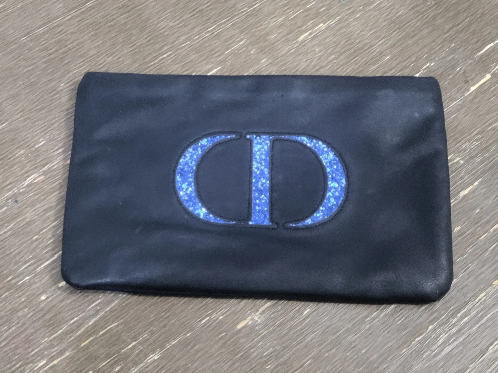 Sac de beauté noir Christian Dior logo bleu scintillant pochette vintage