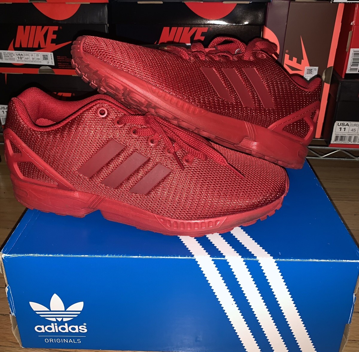 All red adidas zx flux