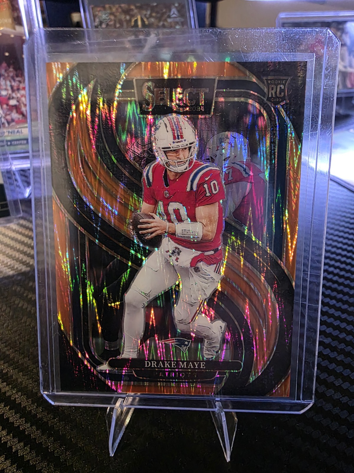 2024 Panini Select - Premier Level Drake Maye #113 Orange Shock Prizm /399 (RC)