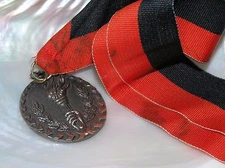 Vintage Coppery Bronze Carry the Torch Medal on Black & Red Fabric Hanger – 