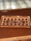 Pink Depression cranberry glass pressed glass rectangular tray with a bow motif