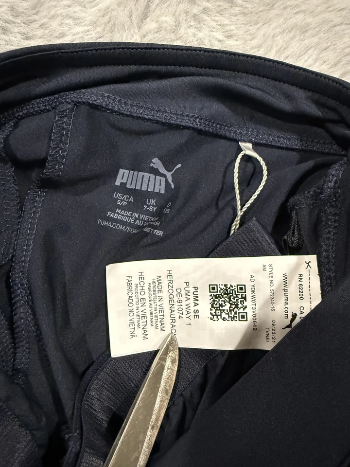 Falda de natación Puma para mujer pequeña azul marino UPF 50+ protección solar pantalones cortos desmontables Foto 2 de 4