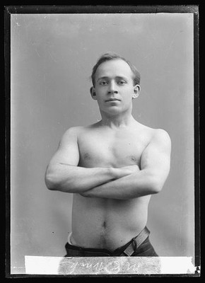 Photo:Frank M E Portrait Shirtless Man Arms Crossed 1903-1905